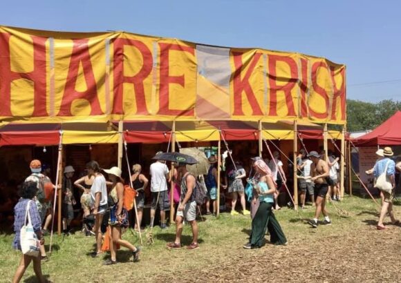 Devotees embrace the Glastonbury crowds
